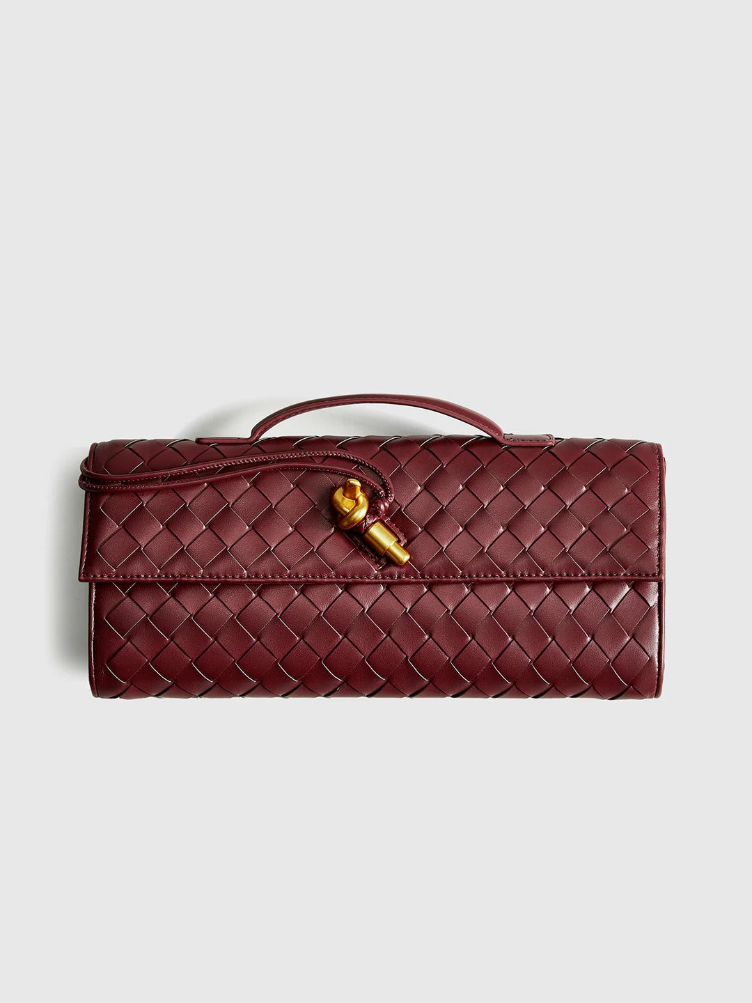 Bolso de mano tipo clutch con solapa tejida bidireccional
