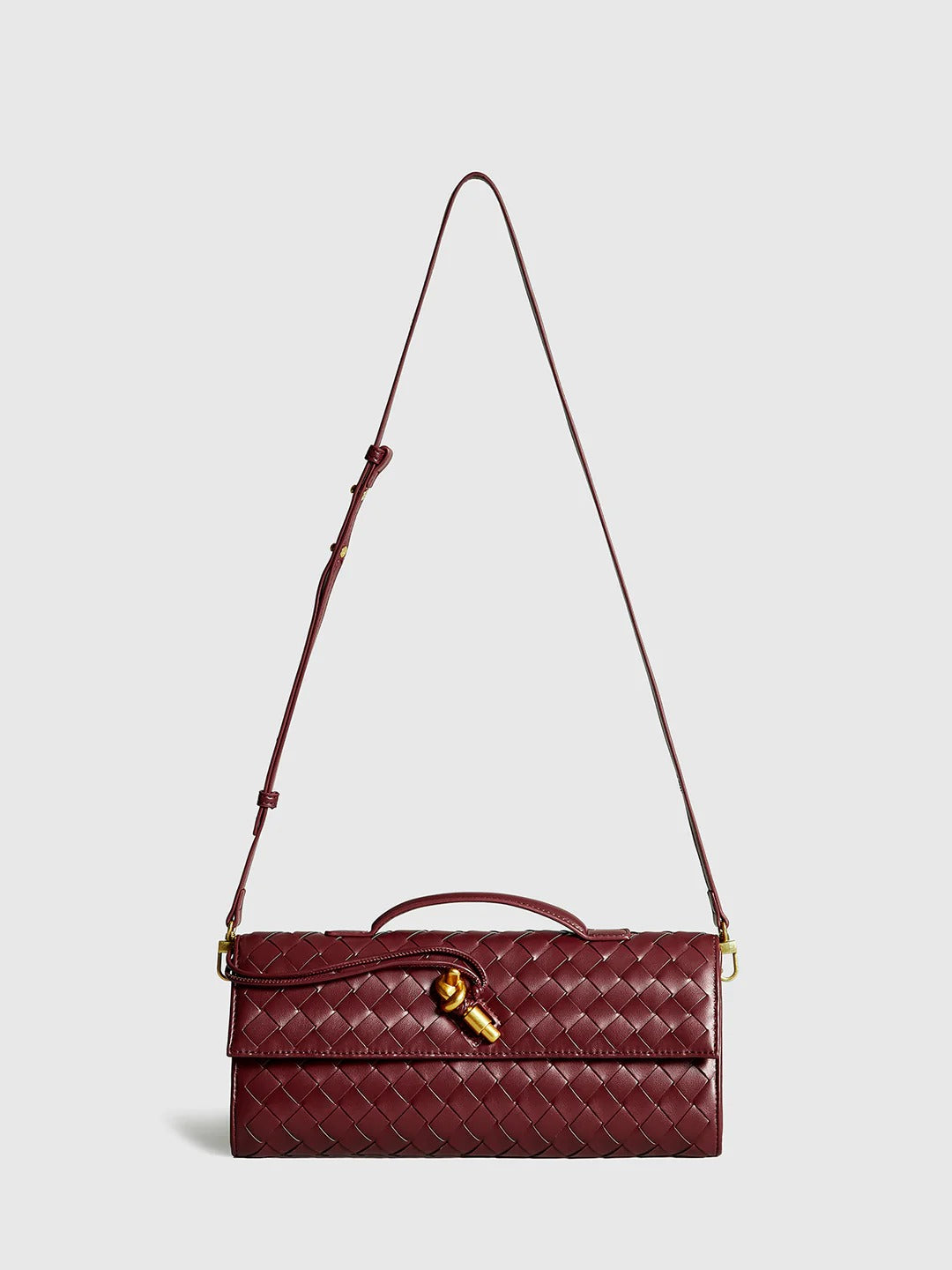 Bolso de mano tipo clutch con solapa tejida bidireccional