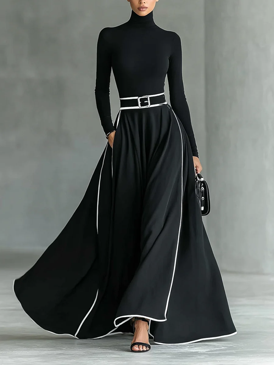 Vestido largo negro para mujer con costuras blancas, cuello alto, mangas largas y cintura ajustada.