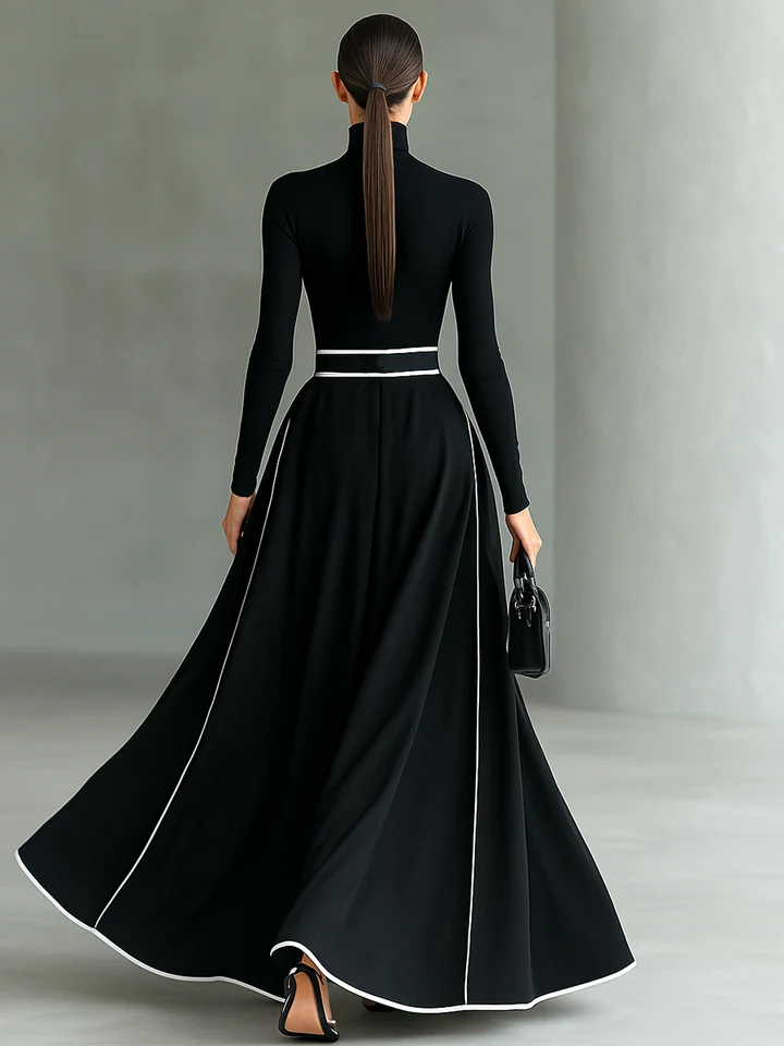 Vestido largo negro para mujer con costuras blancas, cuello alto, mangas largas y cintura ajustada.